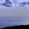 Colored image at dawn with airplane and ship on the sea