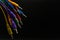 Colored jack cables on black insulated background, selected focus, Copy paste, Music concept