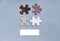 Colored Jigsaw Puzzle pieces on gray background top view. Concept for Unite to end racism. Symbol of association and