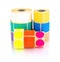 Colored label rolls isolated on white background with shadow reflection. Color reels of labels for printers.