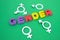 Colored letters gender with symbols on green background