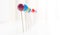 Colored lollipops fading into a white background