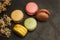 Colored macarons on a metal table