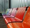 Colored metal bench at a tram bus train stop