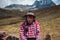 COLORED MOUNTAINES, PERU - OCTOBER 8, 2016: Portrait of a Native Peruvian man wearing typical clothes and hat