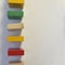 Colored, multi-colored dominoes stand on a white background