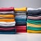 Colored multi-colored T-shirts lie in a stack