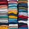 Colored multi-colored T-shirts lie in a stack