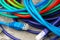 Colored network cable patch-cord on gray textured background