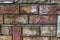 Colored old bricks of varying size texture photo close up