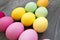 Colored painted eggs on a gray table. Easter celebrating