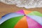 Colored parasol and sandy beach