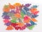 Colored Pasta-dinosaurs on a white background