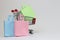 Colored pastel shopping bags and a small metal trolley on a white background. Concept for sale, online shopping, discounts