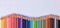Colored pencils aligned waveform palette on checkered sheet