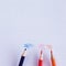 colored pencils and a piece of paper, flatlay photography of office supplies