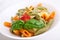 Colored penne pasta with cheese
