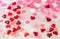 Colored (pink, red and orange), transparent heart shape jellies, colored degradee background