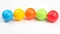 Colored plastic balls on white background