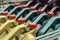 Colored plastic cans with engine oil. Rows of canisters placed on a pallet.