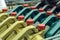 Colored plastic cans with engine oil. Rows of canisters placed on a pallet.