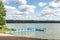 Colored plastic pier on the shore of a large lake