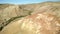 Colored rocks . Flying over red rock formation in Southern mountains. Aerial shot, 4K.