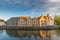 Colored romantic houses by the canal in the historic city center of Brugge