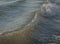 Colored sea waves with splashes and white breakers in Circeo park, Sabaudia, Italy