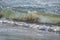 Colored sea waves with splashes and white breakers in Circeo park, Sabaudia, Italy