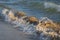 Colored sea waves with splashes and white breakers in Circeo park, Sabaudia, Italy