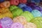 Colored skeins of yarn arranged in beautiful rows, multi-colored, yarn for knitting. wool, acrylic.
