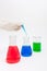 Colored solution in laboratory flasks
