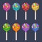 Colored spheric lollipops set on white sticks