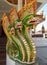 Colored statue of a green dragon in the buddist temple