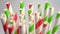 Colored striped bright paper drinking straws close up