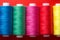 Colored thread on bobbins red yellow green blue