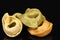 Colored tortellini, ring-shaped pasta on black background