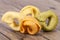 Colored tortellini, ring-shaped pasta on wooden plank