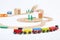 Colored train with cars and wooden toy railway