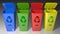 Colored trash recycling cans - 3D rendering