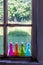 Colored Vintage Bottles on Window Sill