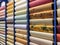Colored wallpaper rolls on store shelves. Paper material for repair
