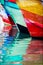 Colored water reflections . Colorful boats in the seaport .