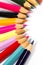 Colored wooden sharpened pencils for office and school on a white background