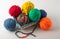 Colored wool knit balls placed on a