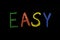 Colored word `easy` drawn on chalkboard