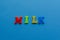 Colored word `milk` from plastic magnets
