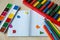 Colorful abacus , pencils, clock, chalkboard on the wooden background. Education, back to school