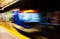 Colorful abstract with motion blur of subway train exiting station platform.